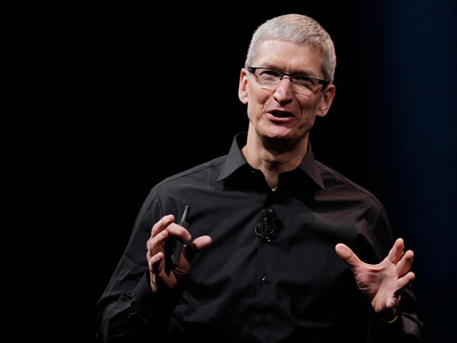 In this Wednesday, Sept. 12, 2012 photo, Apple CEO Tim Cook speaks during an introduction of the new iPhone 5 in San Francisco. Cook is scheduled to testify on Capitol Hill on Tuesday May 21, to explain the companyÕs tax strategy, which a Senate subcommittee says lets it avoid paying billions of dollars in taxes. (AP Photo/Eric Risberg, File)