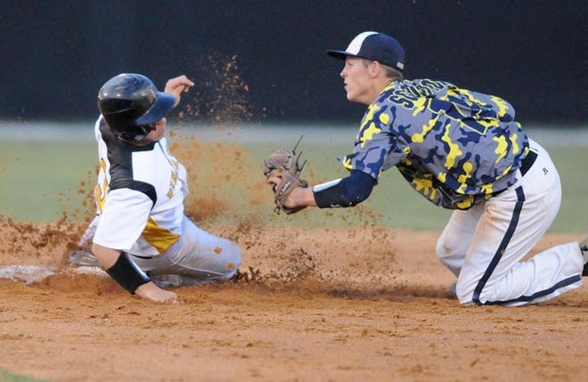Topsail’s Addison Futrell steals second base just under the tag from North Brunswick’s Randy Clark during Tuesday’s 2A state baseball playoff game in Hampstead.