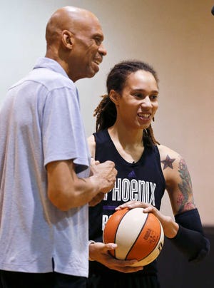 Griner shares a laugh with NBA Hall of Fame player and all-time leading scorer Kareem Abdul-Jabbar, after the two worked out at the Mercury's basketball practice court.