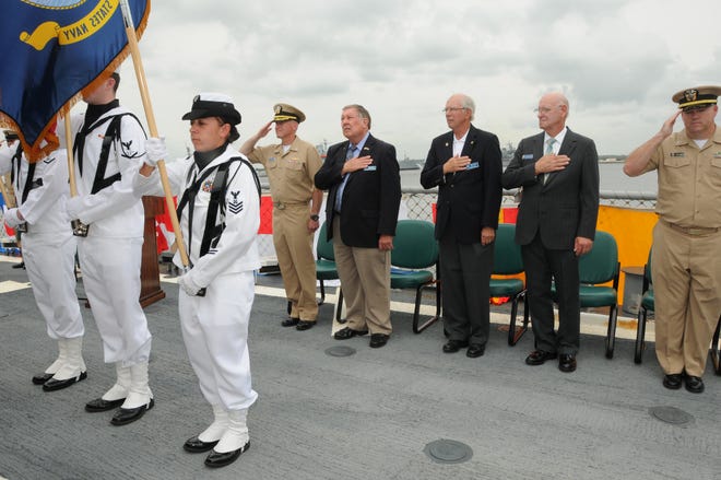 USS The Sullivans Color Guard parades the Colors as members of the St. Augustine Navy League, Cmdr. Sam DeCastro, The Sullivans commanding officer, and Chaplain Buster Williams stand for the National Anthem during a ship adoption ceremony on May 20.