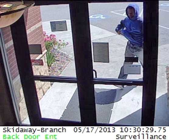 Photo provided by Savannah-Chatham police.  The FBI and Savannah-Chatham police are asking the public to help identify and locate the man pictured here trying to enter Carver State Bank on Skidaway Road Friday.
