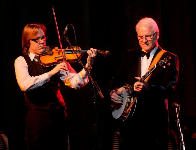 Steve Martin, right, performs with his band, the Steep Canyon Rangers, at Muhammad Ali’s Celebrity Fight Night at the JW Marriott Desert Ridge Resort and Spa last month in Phoenix. (The Associated Press/Invision/File)