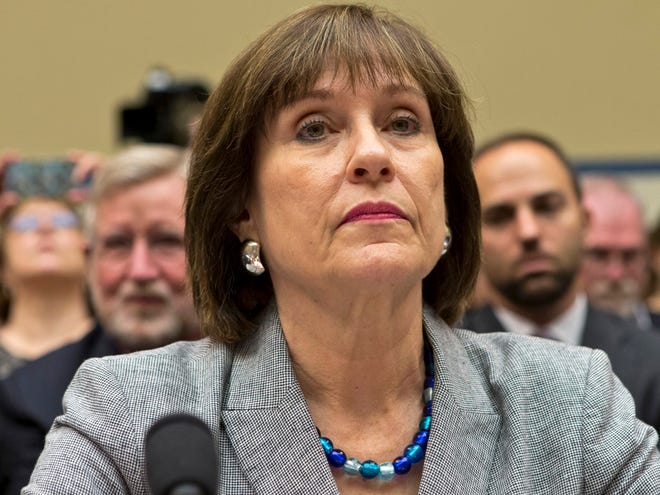In this May 22, 2013, photo, Lois Lerner listens on Capitol Hill in Washington. A day after she refused to answer questions at a congressional hearing, Lerner has been replaced as director the Internal Revenue Service division that oversaw agents who targeted tea party groups. Danny Werfel, the agency's new acting commissioner, told IRS employees in an email Thursday, May 23, 2013, that he has selected a new acting head of the division, staying within the IRS to find new leadership. (AP Photo/J. Scott Applewhite)