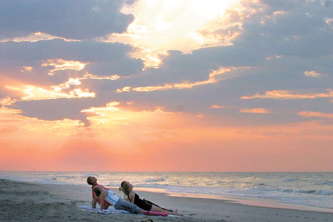 Special sunrise yoga classes will be held on the beach in Surf City on Wednesdays during the summer.