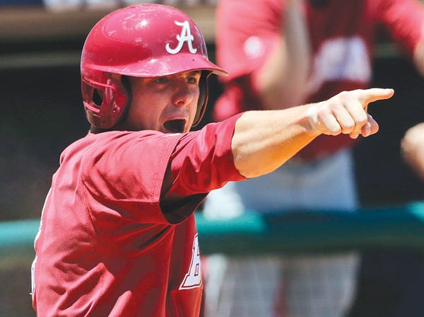 Alabama's Ben Moore celebrates scoring in the 10th inning against Mississippi in the SEC tournament Thursday. (Dave Martin | Associated Press)