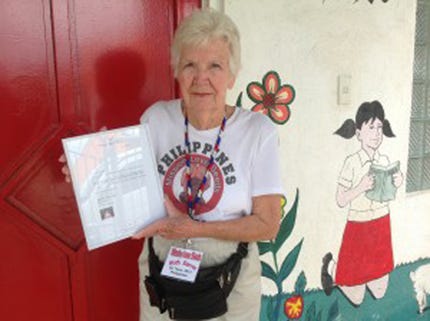 Ruth Server of Destin read a letter from Jane Carron to the children during mission trip.