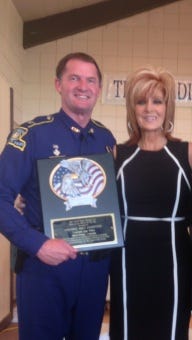 Col. Edmonson accepts the 25th Annual Sheriff Buford Pusser National Law Enforcement Award in Adamsville, Tenn. Pictured with Col. Edmonson is Dwana Pusser, daughter of the late Sheriff.