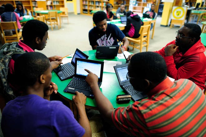 T.W. Josey High School students work with laptop computers purchased with money from the federal School Improvement Grant. In 2010, Josey was part of the bottom 5 percent of the nation's worst performing schools.