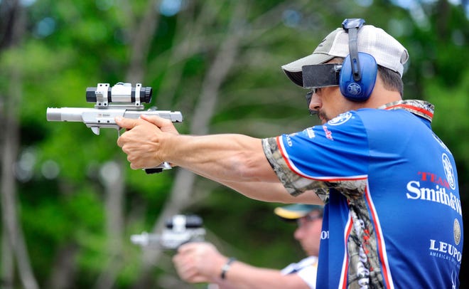 Doug Koenig competes in the Practical Event at the Bianchi Cup NRA National Action Pistol Championship on Wednesday. Shooters fire at distances from 10 to 50 yards under varying time limits. Koenig has won 11 of the past 13 Bianchi Cup titles