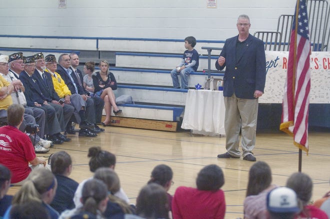 John Huff/Staff photographer

U.S. Army Col. George Harrington talks to students at the Somersworth Middle School about service to community and country during a Memorial Day assembly Friday morning.