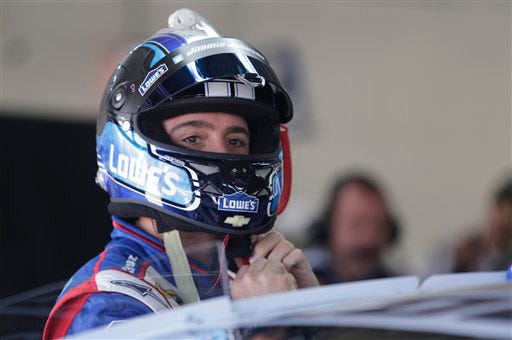 Jimmie Johnson prepares for practice for Sunday's Coca-Cola 600 auto race at Charlotte Motor Speedway in Concord, on Saturday.