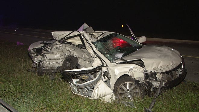 A Toyota Avalon sits on the side of Interstate 95 Saturday morning after a crash that killed a St. Augustine woman.