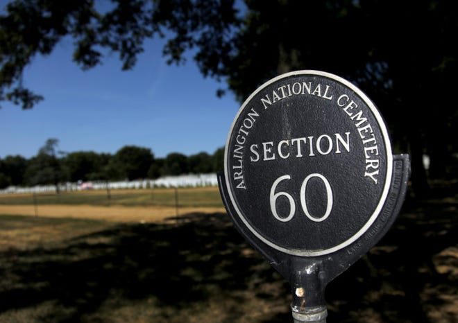 A sign marking Section 60 at Arlington National Cemetery, where many fallen soldiers from the Afghanistan and Iraq conflicts are buried, is seen July 3, 2010, in Arlington, Va. (AP Photo/Pablo Martinez Monsivais)