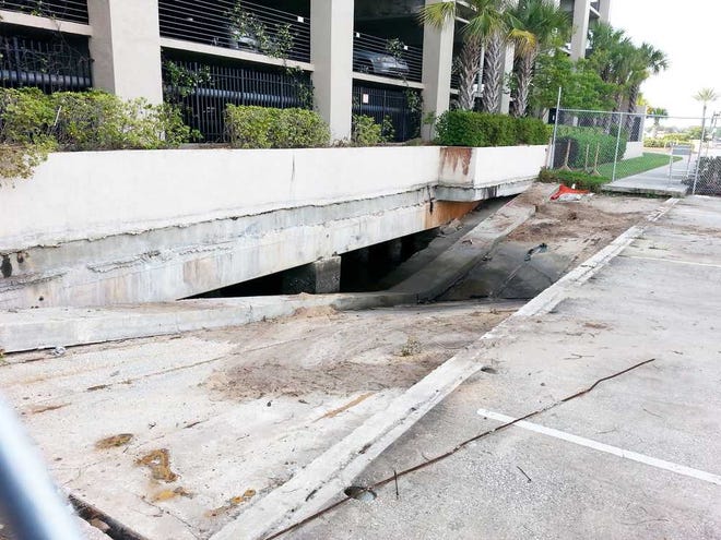 Dan.Scanlan@jacksonville.com The collapsed section of sidewalk on South Liberty Street fell into the St. Johns River below, and the area is now surrounded by a safety fence.