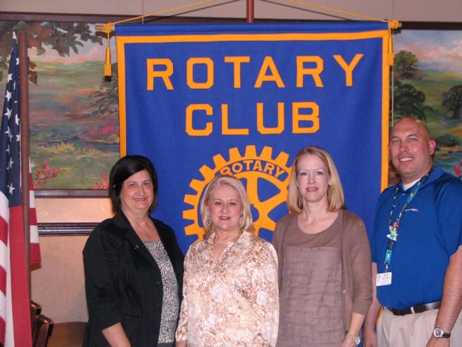 Pictured are Wanda Gauthreaux, Rotarian, Betty Arceneaux, Stacey Bumpus and Mike Buturla, Rotarian President.