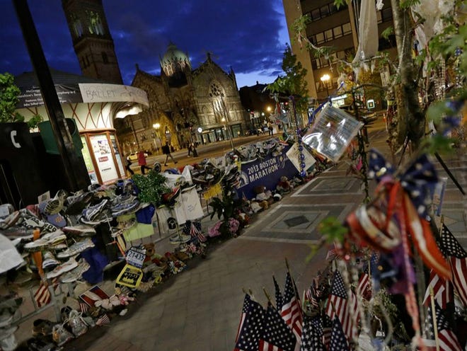 A makeshift memorial remains at Copley Square in Boston almost a month and a half after the bombings at the Boston Marathon finish line. An organization can't afford to wait until a crisis hits to plan for its response, Lochridge said.
(ELISE AMENDOLA | THE ASSOCIATED PRESS)