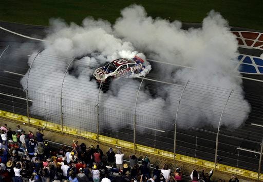 Kevin Harvick (29) does a burnout after winning the NASCAR Sprint Cup Series Coca-Cola 600 auto race at the Charlotte Motor Speedway in Concord on Sunday night.