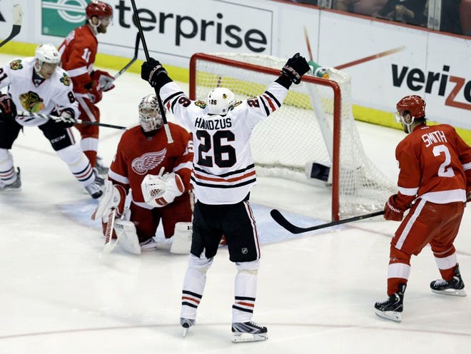 Chicago Blackhawks center  Michal Handzus (26) celebrates scoring a goal against the Detroit Red Wings during the third period of the Blackhawks' win on Monday night.
(Paul Sancya | THE ASSOCIATED PRESS)