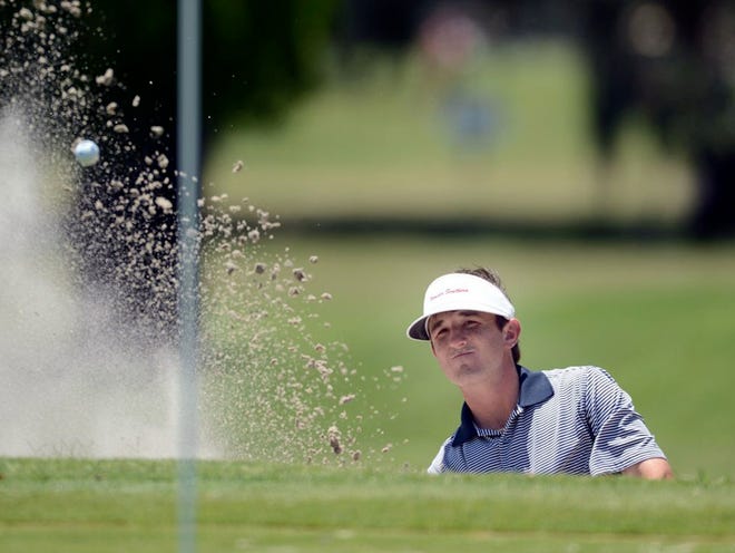 Case Gard of Lakeland hits out of the sand on the 13th hole on Monday during the final round of the Youth Villa Classic at Bartow Golf Course. Gard won the title by three strokes over Drew Guffey.