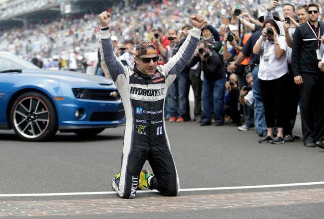 Tony Kanaan celebrates after winning the Indianapolis 500 on Sunday.