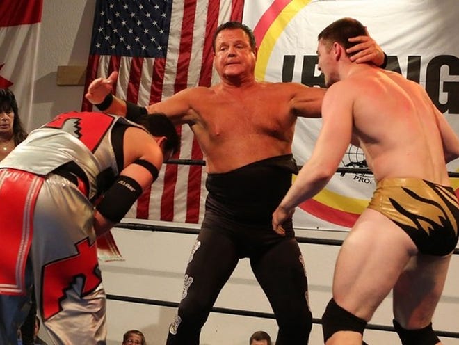 Wrestler Jerry Lawler takes on two opponents during professional wrestling at Dory Funk Jr. Funking Conservatory in Ocala recently. This was Lawler's first wrestling match since his near fatal heart attack last September. (Alan Youngblood/Ocala Star-Banner )