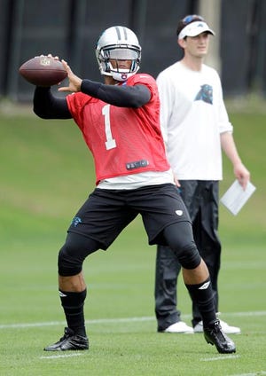 Associated Press Panthers quarterback Cam Newton looks to pass during a practice in Charlotte on Thursday.


Image Description - Carolina Panthers' Cam Newton (1) winds up for a throw during NFL football practice in Charlotte, N.C., Thursday, May 23,2013. (AP Photo/Bob Leverone)