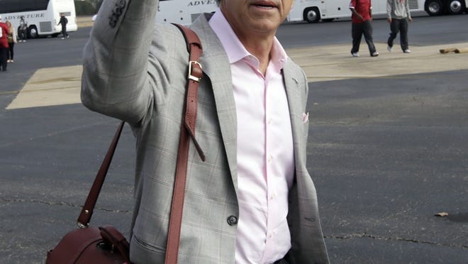 Alabama coach Nick Saban thanks fans who gathered at the Tuscaloosa Regional Airport in Tuscaloosa, Ala., Tuesday, Jan. 8, 2013 to watch the Crimson Tide return from a BCS Championship win over Notre Dame in Miami. Alabama beat Notre Dame 42-14 on Monday to claim third national championship in 4 years and their 15th overall. . (AP Photo/Dave Martin)