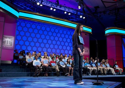 Anna Tran, of Quakertown, spells the word acuminate" correctly during the third round of the National Spelling Bee, Wednesday, May 29, 2013, in Oxon Hill, Md. (AP Photo/Evan Vucci)