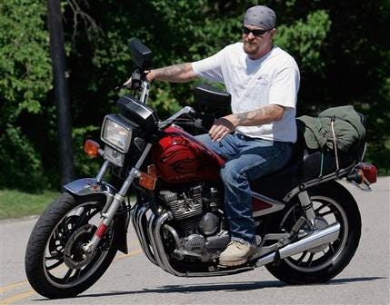 In this June 12, 2008 file photo, Randy Knauff takes off from work without a helmet on his motorcycle in Harmony, Pa. Across the nation, motorcyclists opposed to mandatory helmet use have been chipping away at state helmet laws for years while crash deaths have been on the rise.