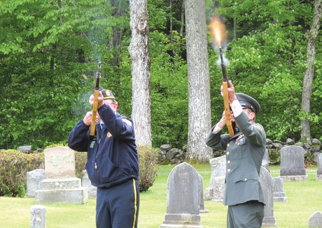 Jim Sullivan and Joe Falco participate in the gun salute at Woodlawn Cemetery.