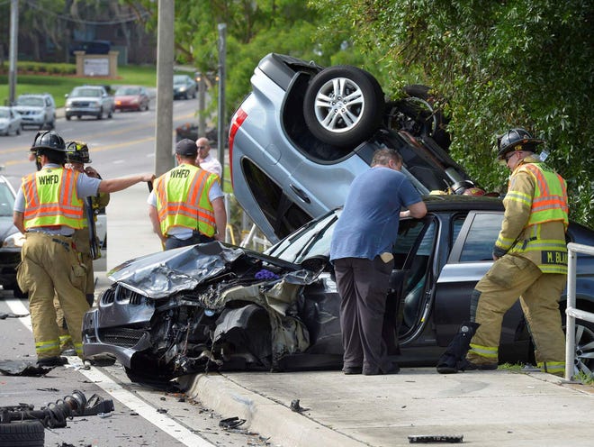 Winter Haven firefighters work an accident scene Thursday morning involving a BMW sedan, a Honda CRV, a Mazda and a Ford Fusion on U.S. 17 in Winter Haven south of Havendale Boulevard near the Banyan Beach Motel.