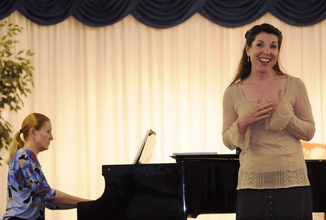 Pianist Olga Rogach and Elaine Crane, executive director of Greater Worcester Opera, at a recent rehearsal for the group’s upcoming gala performances.