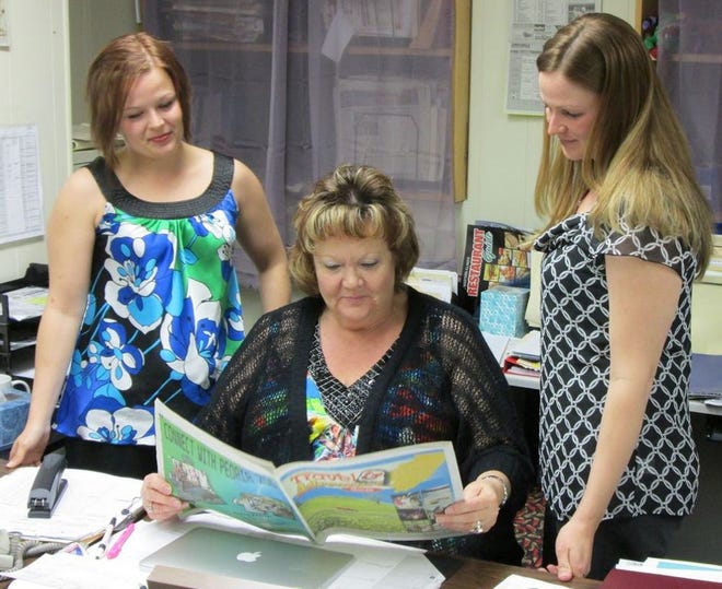 From left, Daily Ledger advertising staff Star Ashwood, Mary White and Stacey Smith plan for the upcoming Senior Expo this Saturday at the Canton Family YMCA.