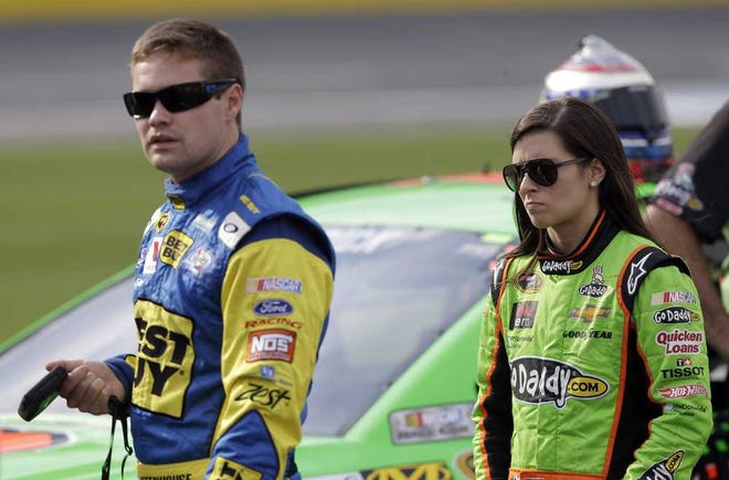Chuck Burton Associated Press Danica Patrick walks with Ricky Stenhouse Jr. on pit road May 17 at Charlotte Motor Speedway in Concord, N.C.