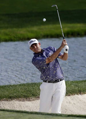 Darron Cummings Associated Press Bill Haas hits out of the bunker on the ninth hole during the second round of the Memorial on Friday in Dublin, Ohio.
