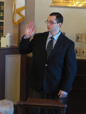 Christopher Manouloules is sworn in before testifying in the murder trial of Robert Upton in Barnstable Superior Court Thursday. 
Photo by Steve Heaslip/Cape Cod Times