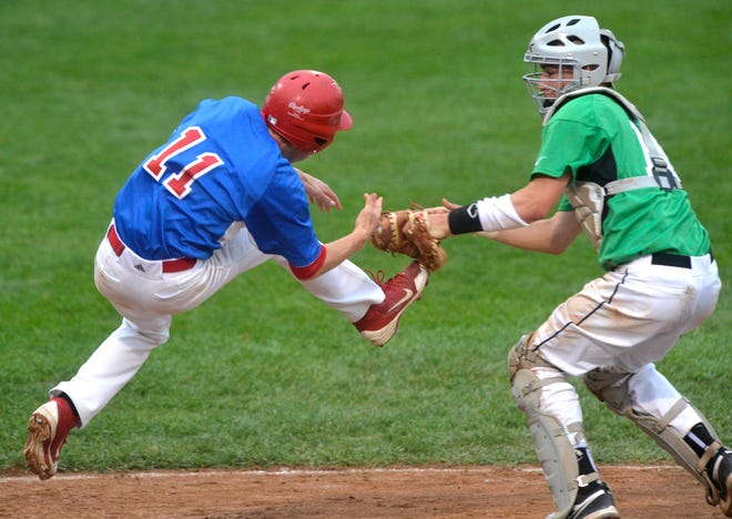 Eureka catcher Jared McCunn tags Zach Ross of Pleasant Plains to make the out at the plate during Friday's Class 2A state baseball semifinal game.