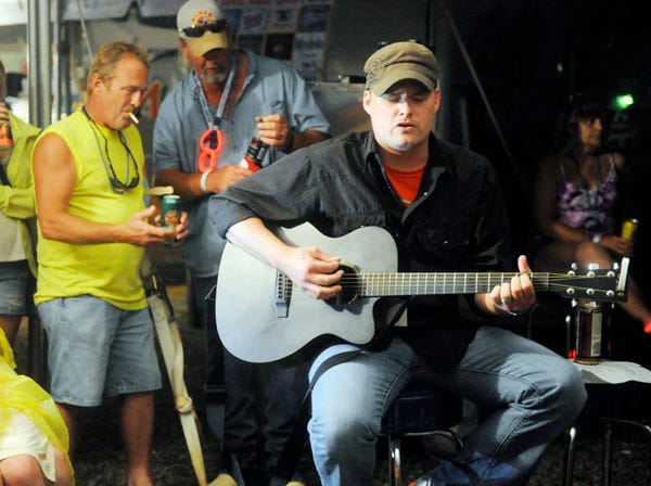 After his show on the main stage being rained out Jeremy Jackson plays an impromptu acoustic set at the RiverFest pub in Gadsden on Saturday Evening June 1, 2013.