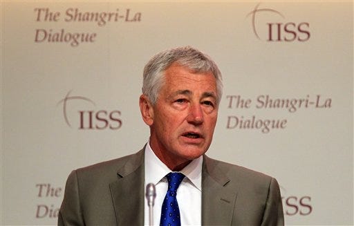 U.S. Defense Secretary Chuck Hagel waits to deliver his keynote address on "The US Approach to Regional Security" at the International Institute for Strategic Studies Shangri-la Dialogue, or IISS Asia Security Summit in Singapore, Saturday, June 1, 2013.