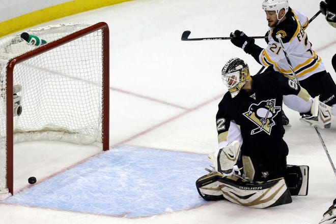 Pittsburgh goalie Tomas Vokoun watches as a shot by Boston's David Krejci gets past him for a goal in Game 1 of the Eastern Conference finals on Saturday in Pittsburgh.