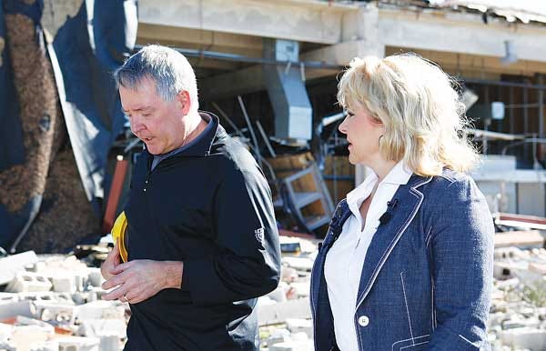 AP Photo/Alonzo Adams - Oklahoma Governor Mary Fallin, right, and Director of Career and Technology Education Dr. Robert Sommers, walk past the damaged Canadian Valley Technology Center in El Reno, Okla.