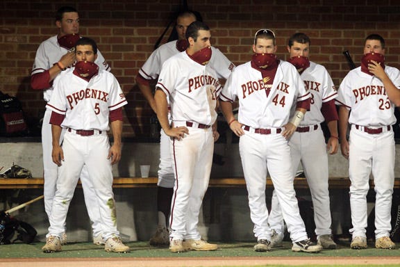 Elon players, including Sebastian Gomez, front left, Dylan Clark, back left, Jordan Darnell, back middle, and Ryan Kinsella, front middle, react to Saturday night's loss against Virginia.