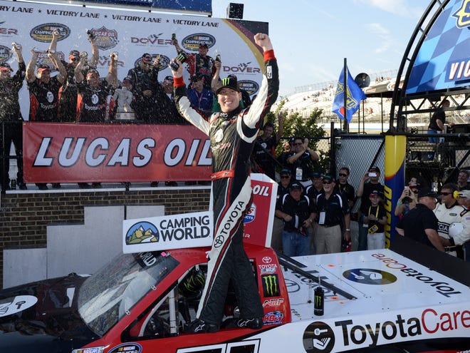 Kyle Busch celebrates in Victory Lane after he won the NASCAR Truck Series race Friday at Dover International Speedway in Dover, Del.