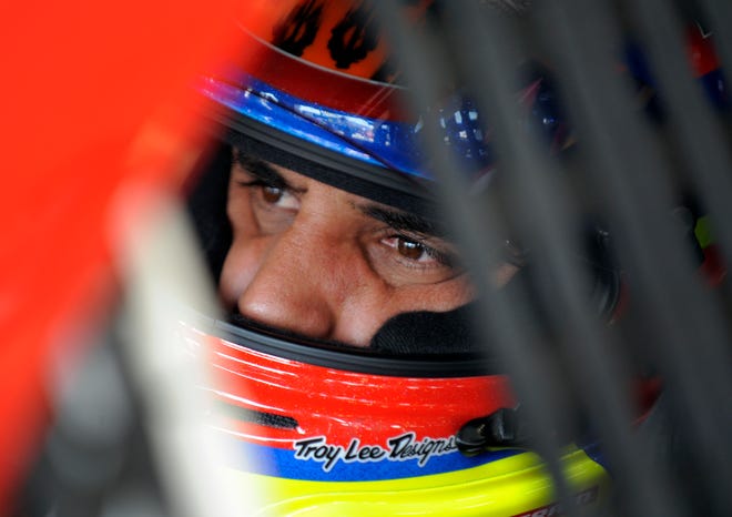 FILE - In this May 17, 2013 file photo, Juan Pablo Montoya, of Colombia, waits in his race car before practice for the NASCAR Sprint Showdown auto race at Charlotte Motor Speedway in Concord, N.C. Montoya has had 218 chances to win on an oval in NASCAR. It's made his two near misses this season painful to watch because they come at a time when Montoya desperately needs to prove his worth. (AP Photo/Mike McCarn, File)