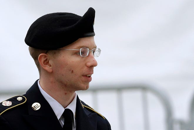 In this May 21, 2013 file photo, Army Pfc. Bradley Manning is escorted into a courthouse in Fort Meade, Md., before a pretrial military hearing. More than three years ago, Army Pfc. Bradley Manning was arrested in Iraq and charged in the biggest leak of classified information in U.S. history. About 20 Manning supporters demonstrated Monday morning in the rain outside the visitor gate at Fort Meade. (AP Photo/Patrick Semansky, File)