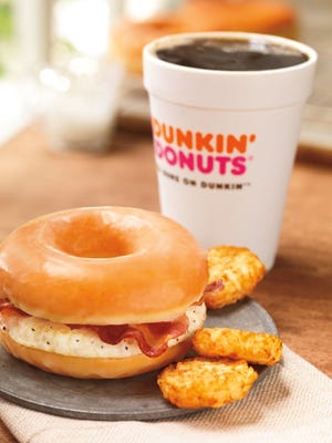 This photo provided by Dunkin' Brands, Inc., shows the company's glazed donut breakfast sandwich. Even as fast-food chains tout their healthy offerings, they're also coming up with fatty new treats to keep customers interested. Case in point: Dunkin' Donuts is adding a doughnut breakfast sandwich to its national menu beginning June 2013. (AP Photo/Dunkin' Brands, Inc., James Scherer)