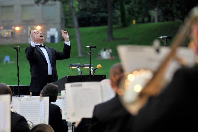 Conductor Dr. David Vroman leads the Peoria Municipal Band on Sunday in its first concert of the season at Glen Oak Park.