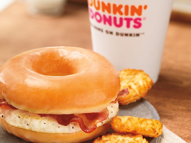 This photo provided by Dunkin' Brands Inc.,shows the company's glazed donut breakfast sandwich. (AP Photo)