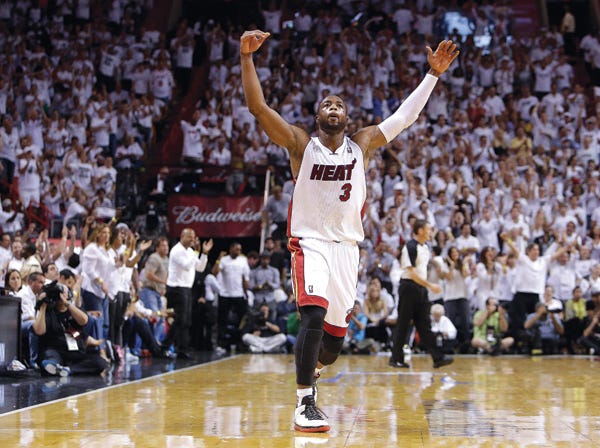 Miami’s Dwyane Wade celebrates late in Monday night’s game against Indiana.
(Lynne Sladky | Associated Press)