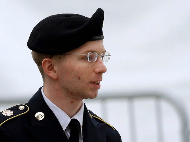 In this May 21 photo, Army Pfc. Bradley Manning is escorted into a courthouse in Fort Meade, Md., before a pretrial military hearing. More than three years ago, Army Pfc. Bradley Manning was arrested in Iraq and charged in the biggest leak of classified information in U.S. history. About 20 Manning supporters demonstrated Monday morning in the rain outside the visitor gate at Fort Meade.